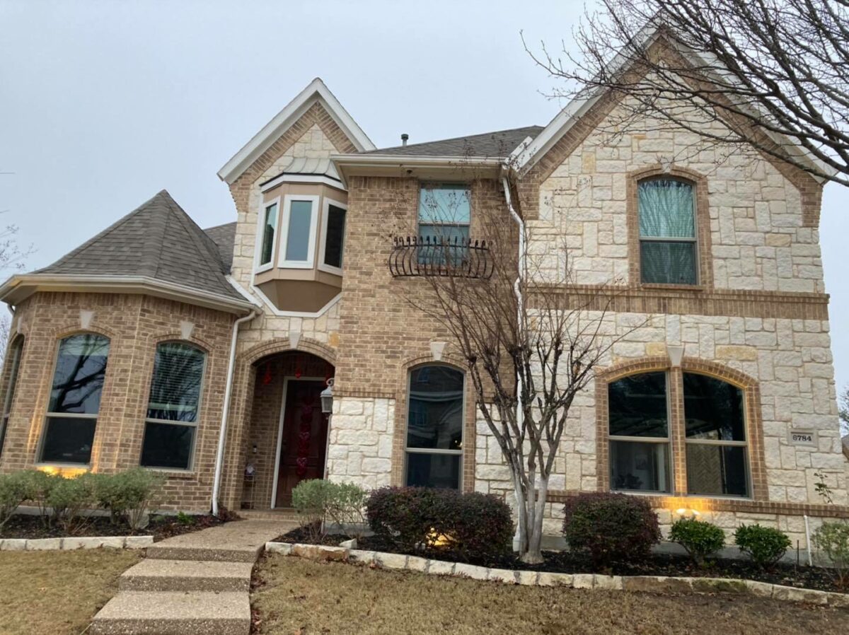 New windows installed on a residential home exterior