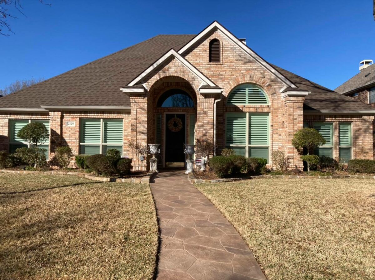 New windows installed on a home with decorative exterior trim