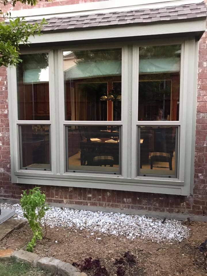 Replacement windows installed on the front of a residential house