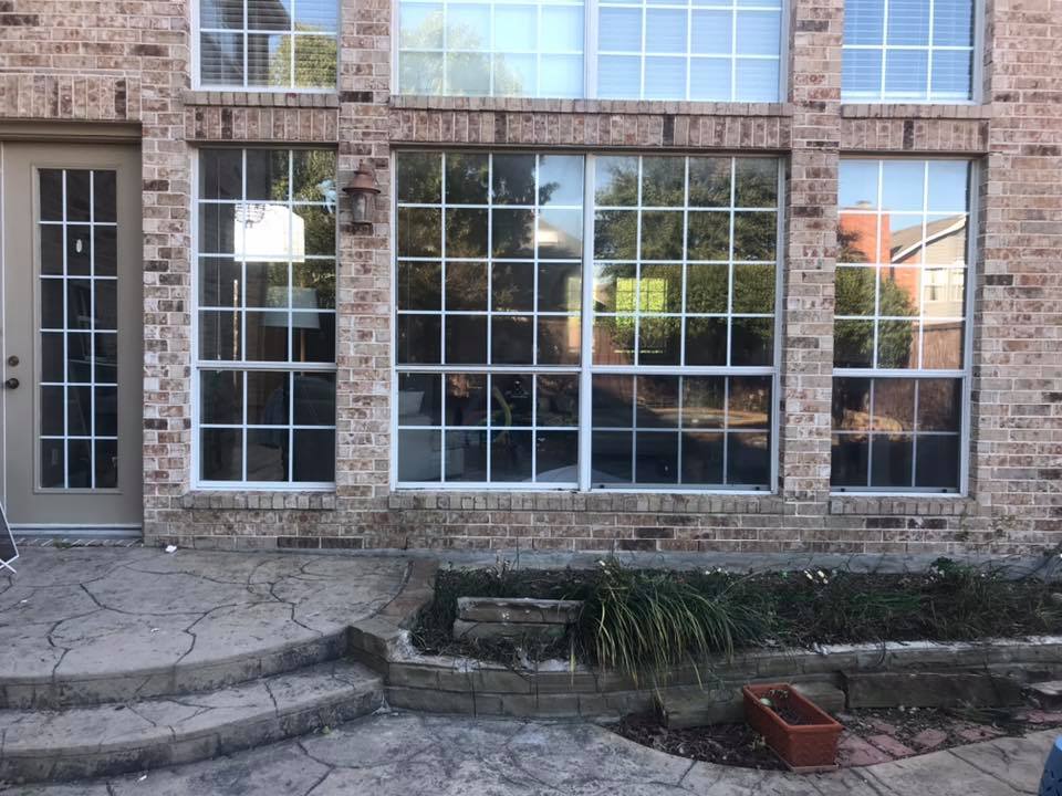 White replacement window installed on a residential home exterior