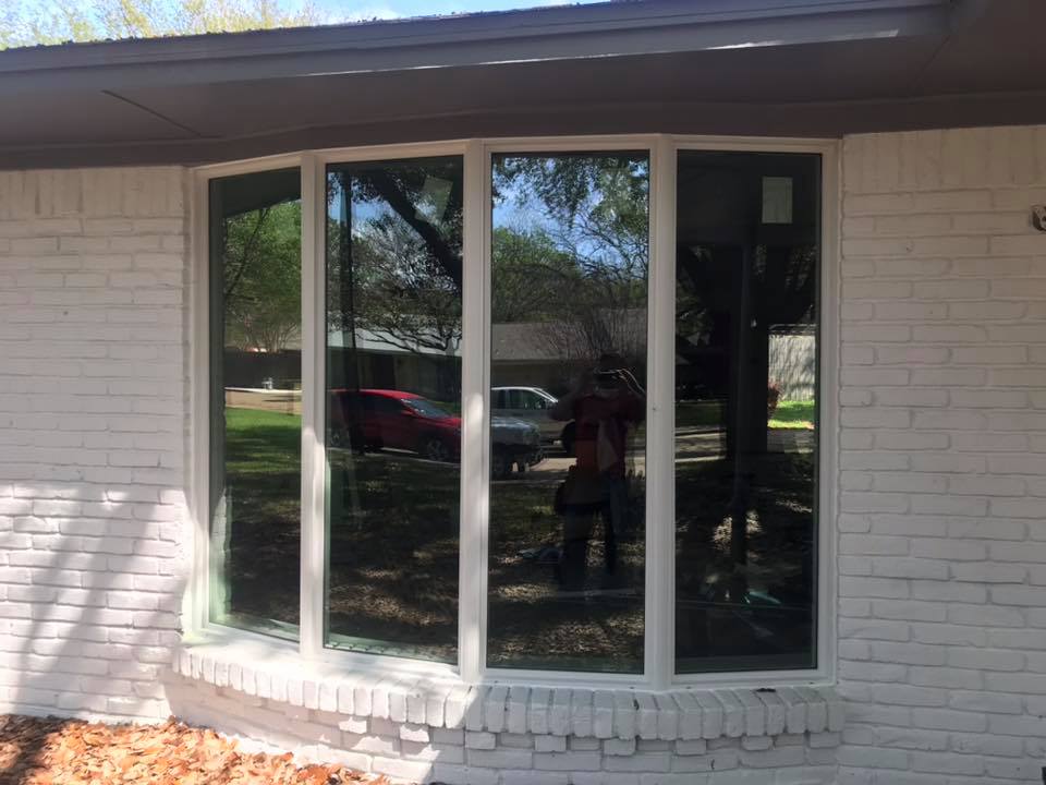Large bay window installed on the exterior of a residential home