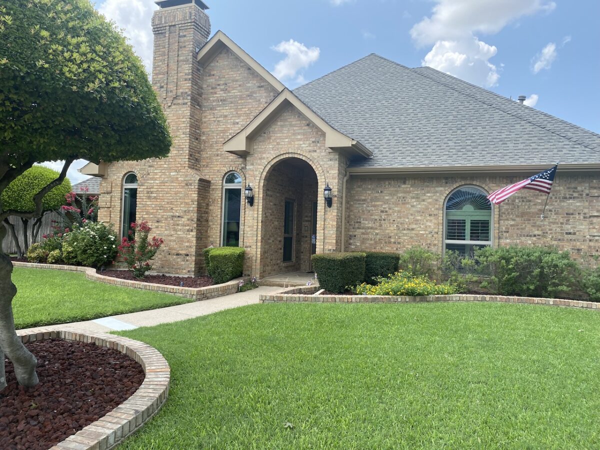 Completed replacement window installation on a house